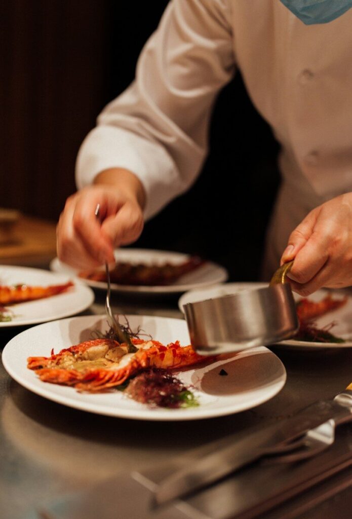 A chef preparing food at a table